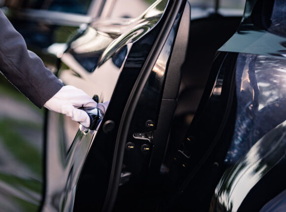 Business Travel car door opening chauffeur